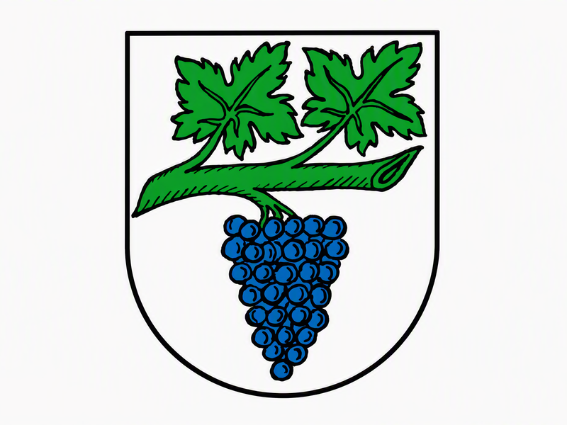 Das Bild zeigt ein Wappen mit einem grünen Weinstock und einer blauen Traube.