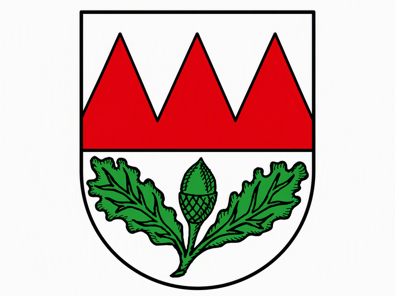 Das Bild zeigt ein Wappen mit drei roten Spitzen oben und zwei grünen Eichenblättern mit einer Eichel unten.